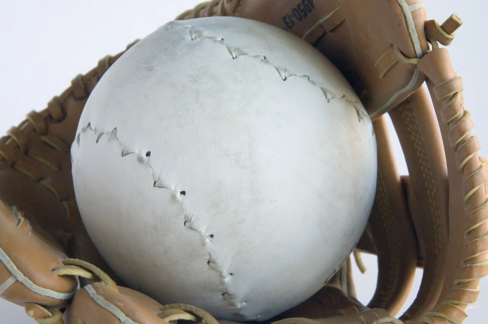 Softball in a baseball glove